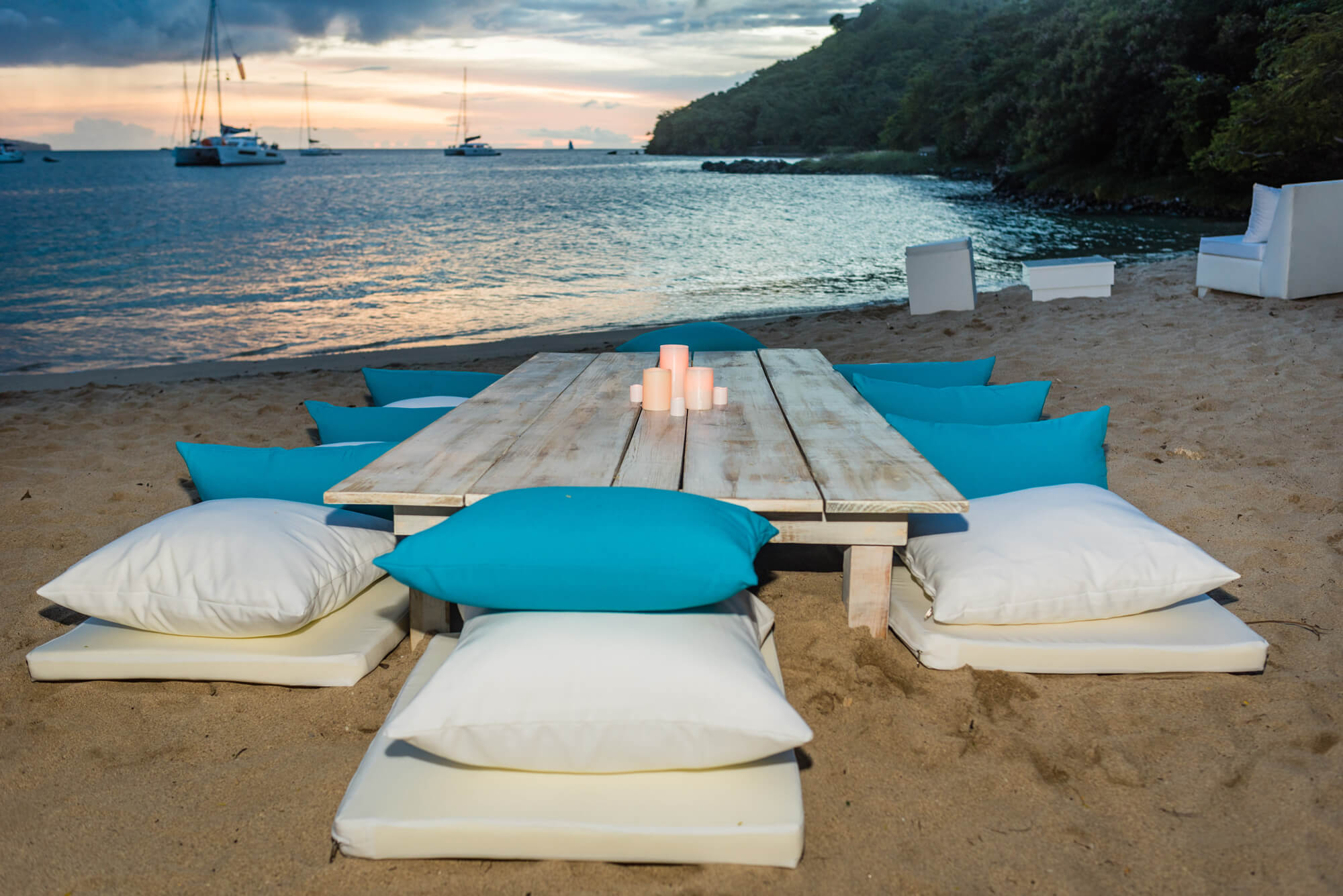 Hosts Global | Mediterranean Decor: Mediterranean Beach seating setup in St. Lucia in the sand