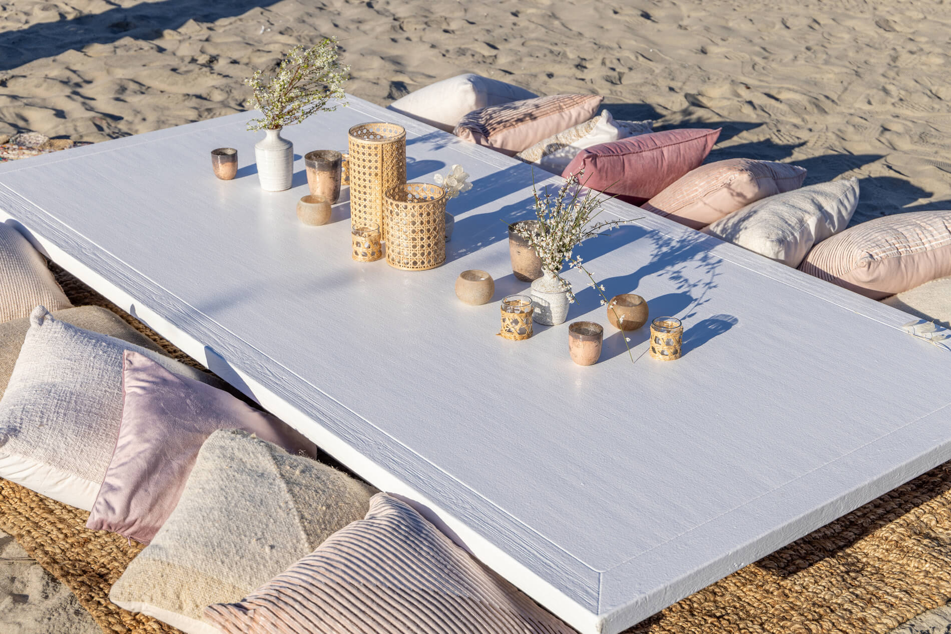 Hosts Global | Mediterranean Decor: Beach seating setup in the sand