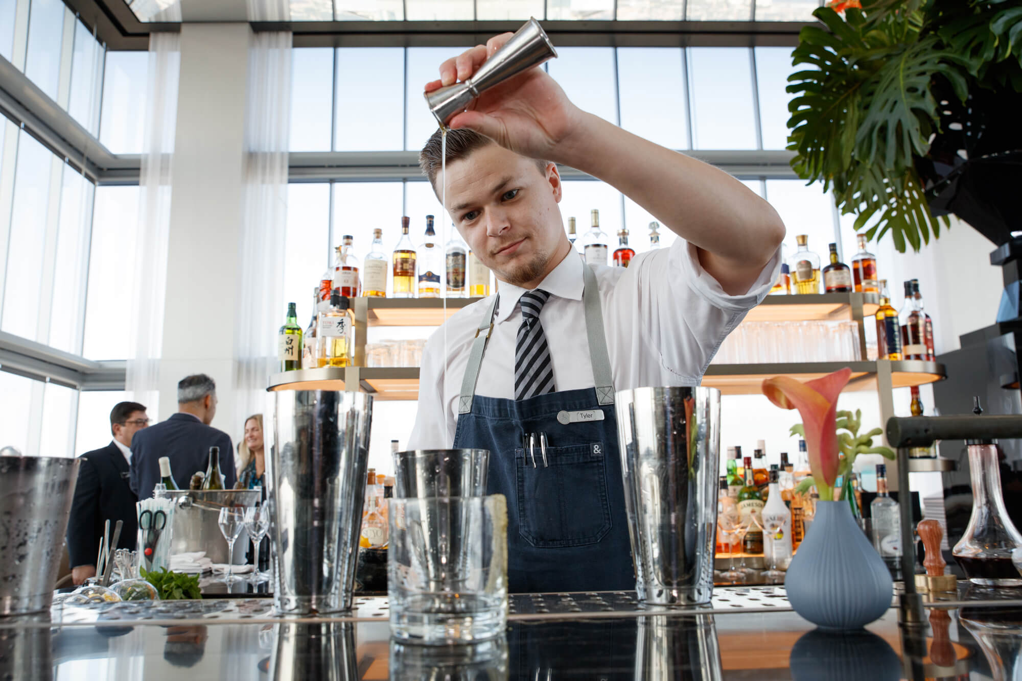 Bartender serving crafted cocktails