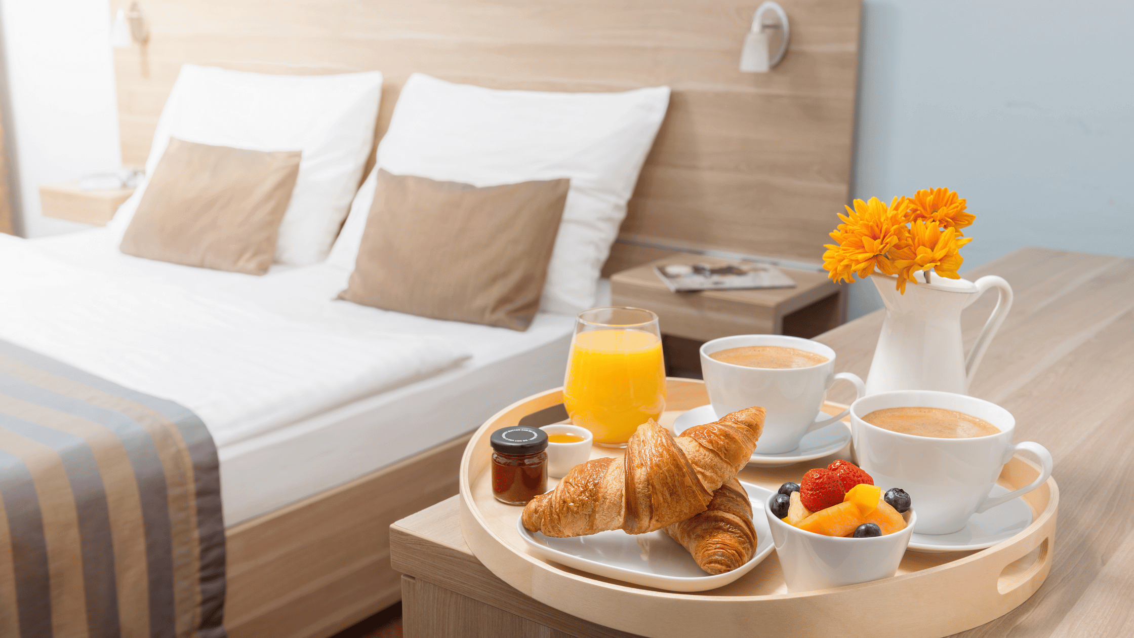 a tray of breakfast on a bed