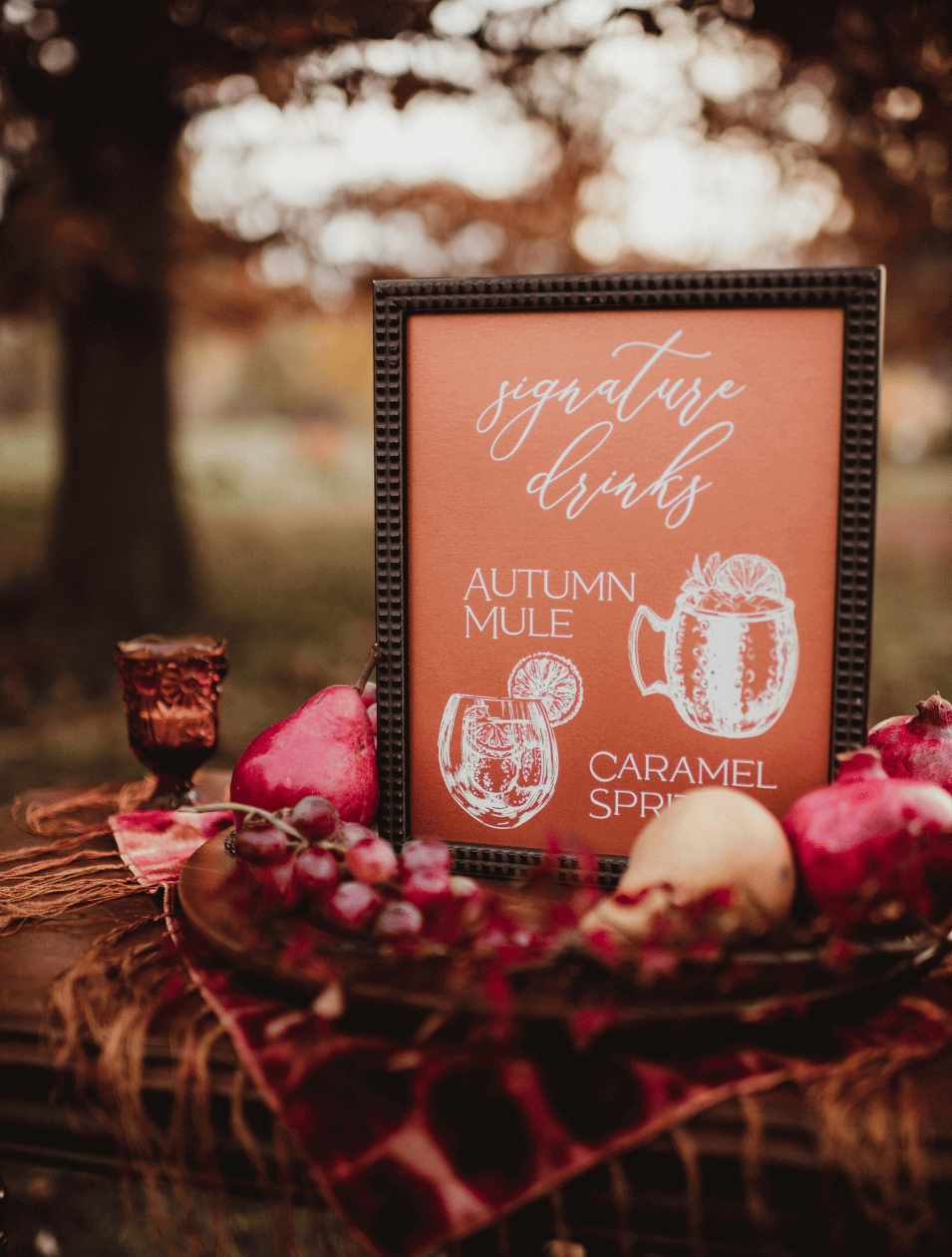 themed cocktails with sign on outdoor tray