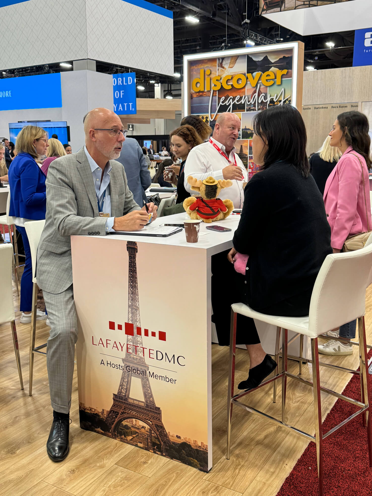 IMEX America Trade show floor, Hosts Global booth with people networking