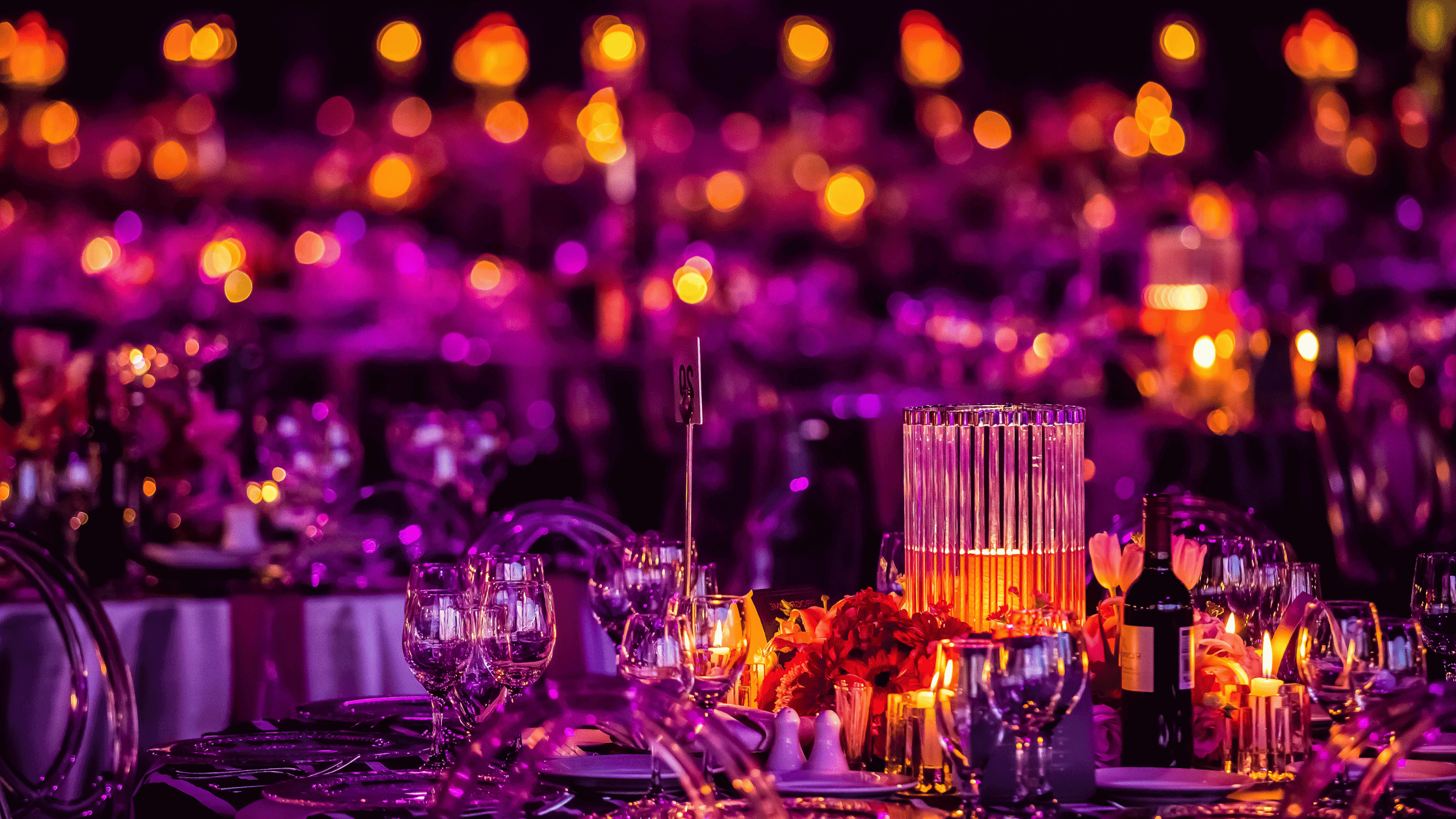 Gala dinner arrangement with candles and flowers