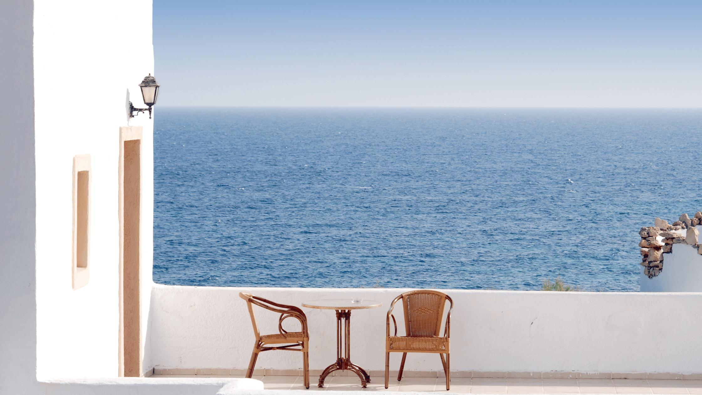 Greek balcony overlooking the Aegean Sea and a table for 2