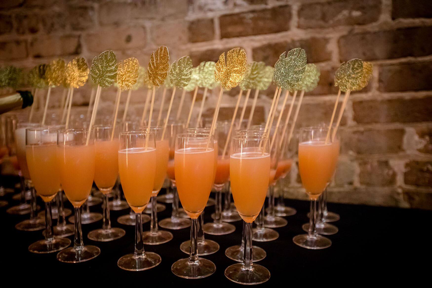 Peach drinks with glittery stirrers 