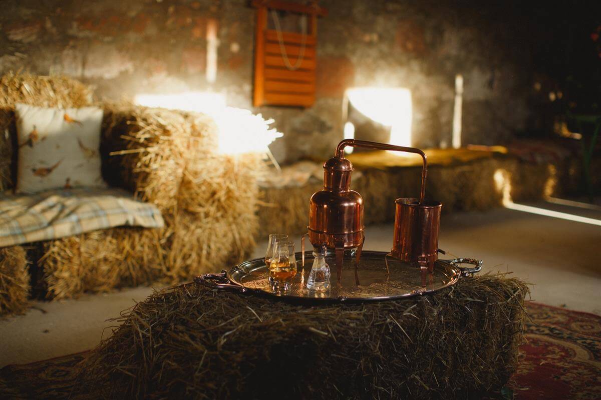 whiskey and scotch tasting with hay bales and silver tray