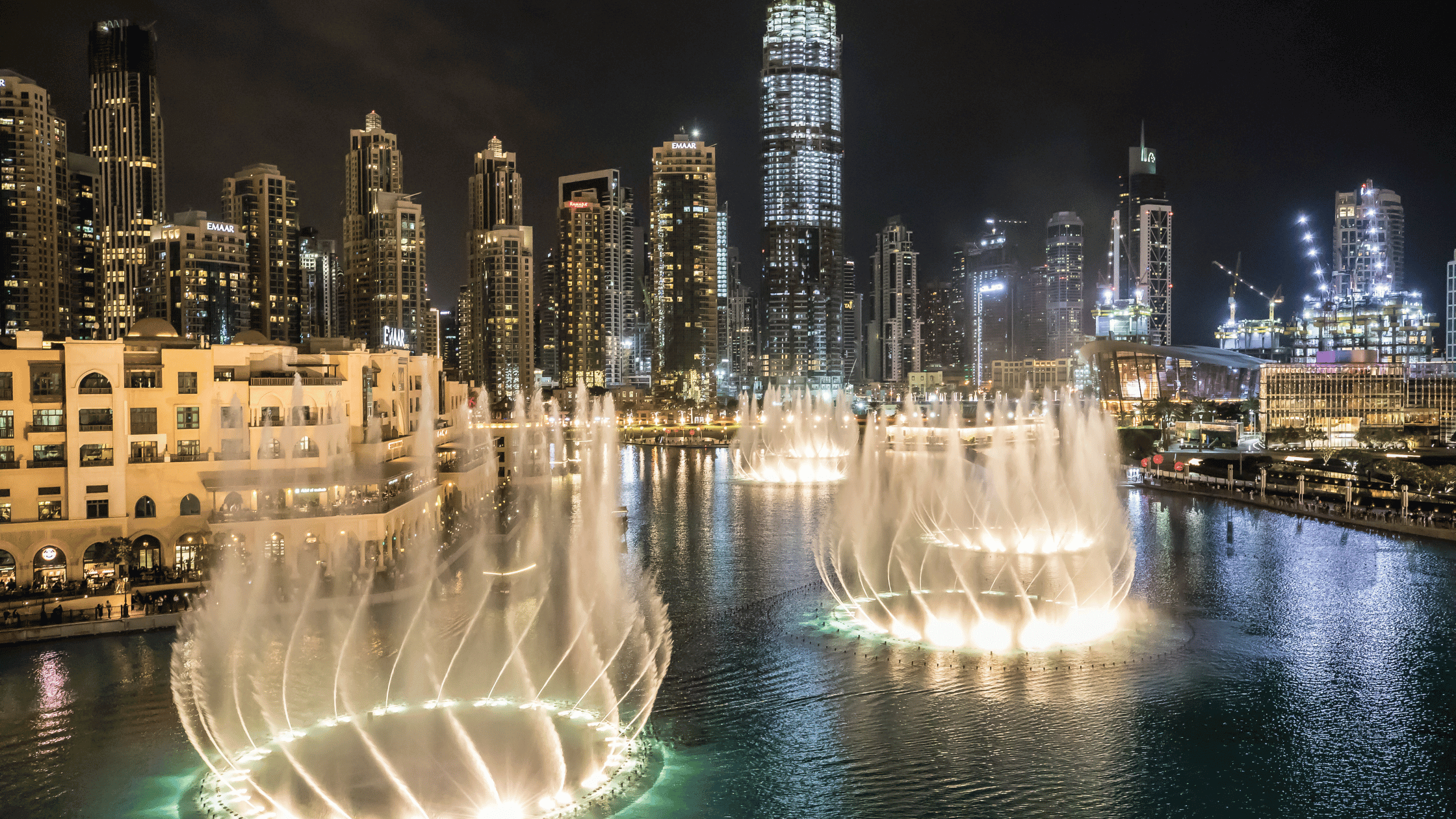 Duabi Fountains at night with City