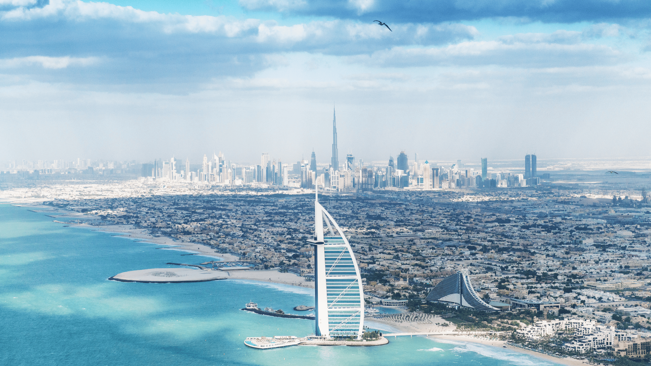 Bruh al Arab on the water and the city of Dubai behind it