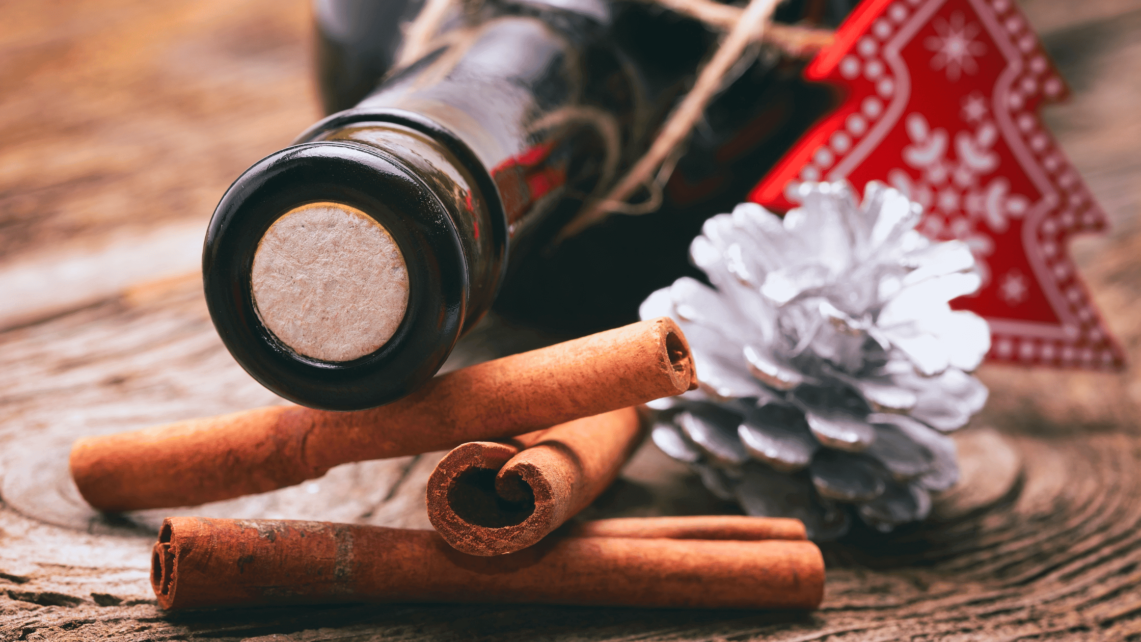 Wine with Ornament and cinnamon sticks and pinecone 