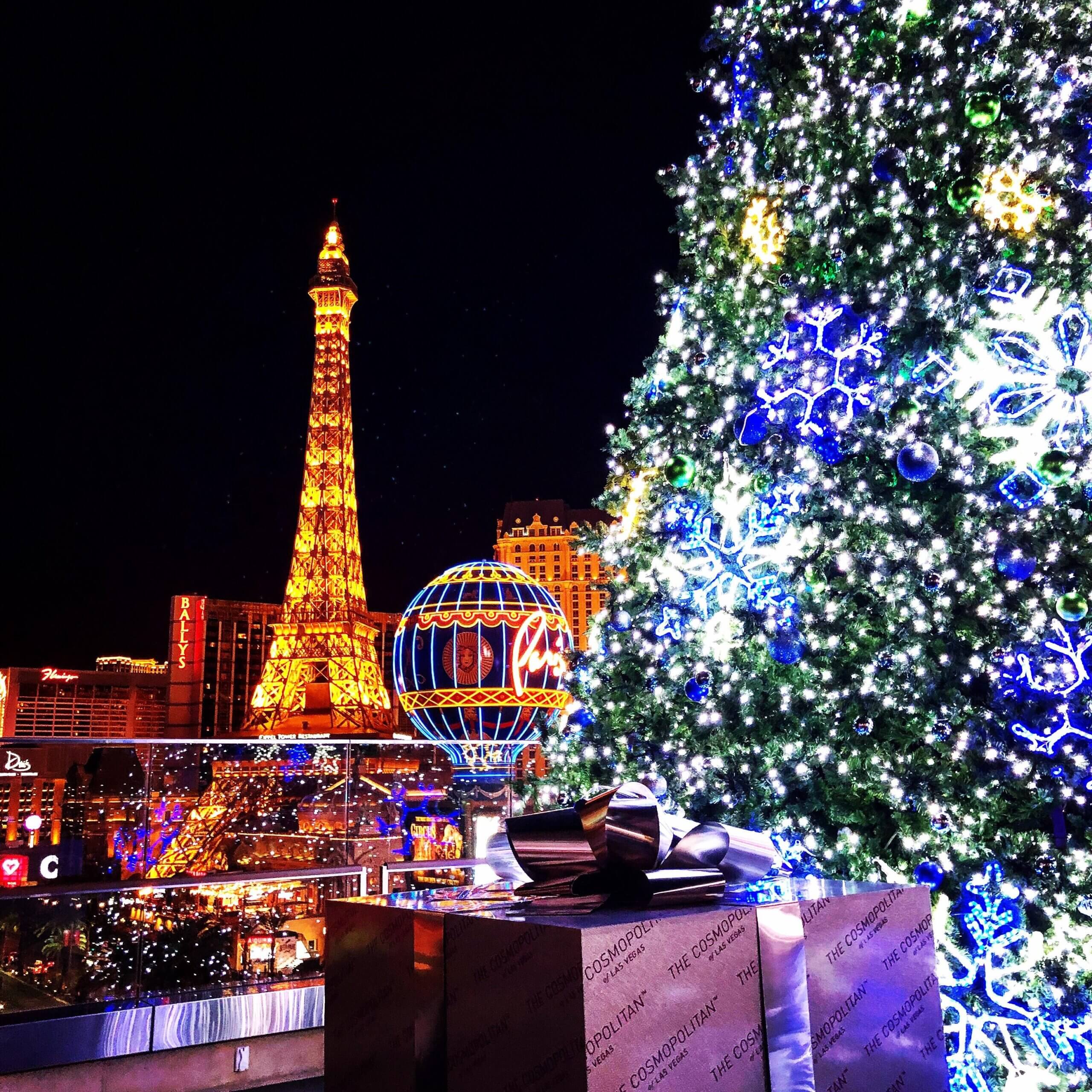 Hosts Global | Las Vegas at Christmas time with lit tree and the Paris Hotel in the background