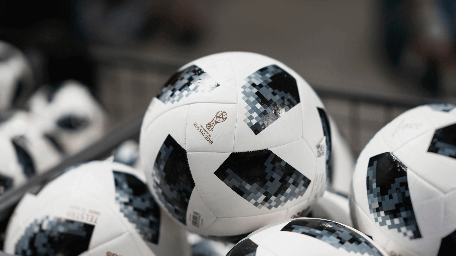 Hosts Global | FIFA logo on a group of soccer balls