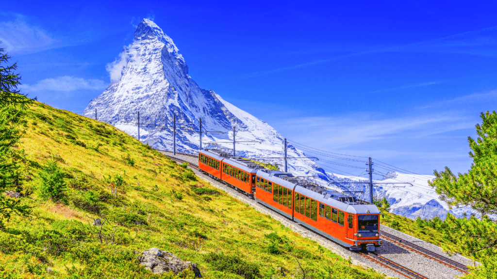 Zermatt, Switzerland. Gornergrat tourist train with Matterhorn mountain in the background. Valais region _ World Events Consulting, A Hosts Global Member